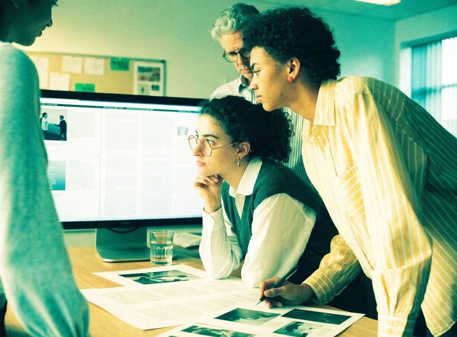 Editorial team reviewing a branded feature